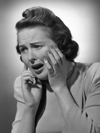 vintage woman on telephone with worried expresion